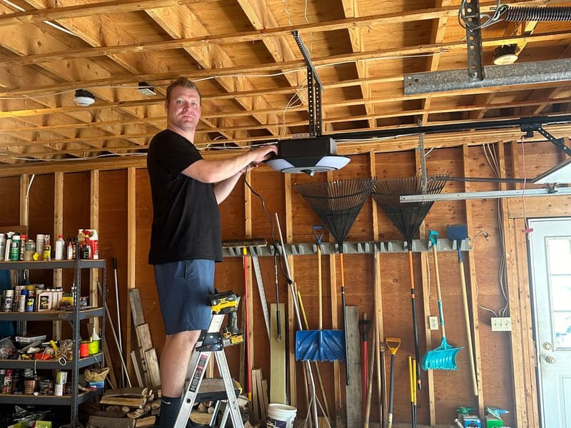 Murray technician installing garage door opener in residential garage